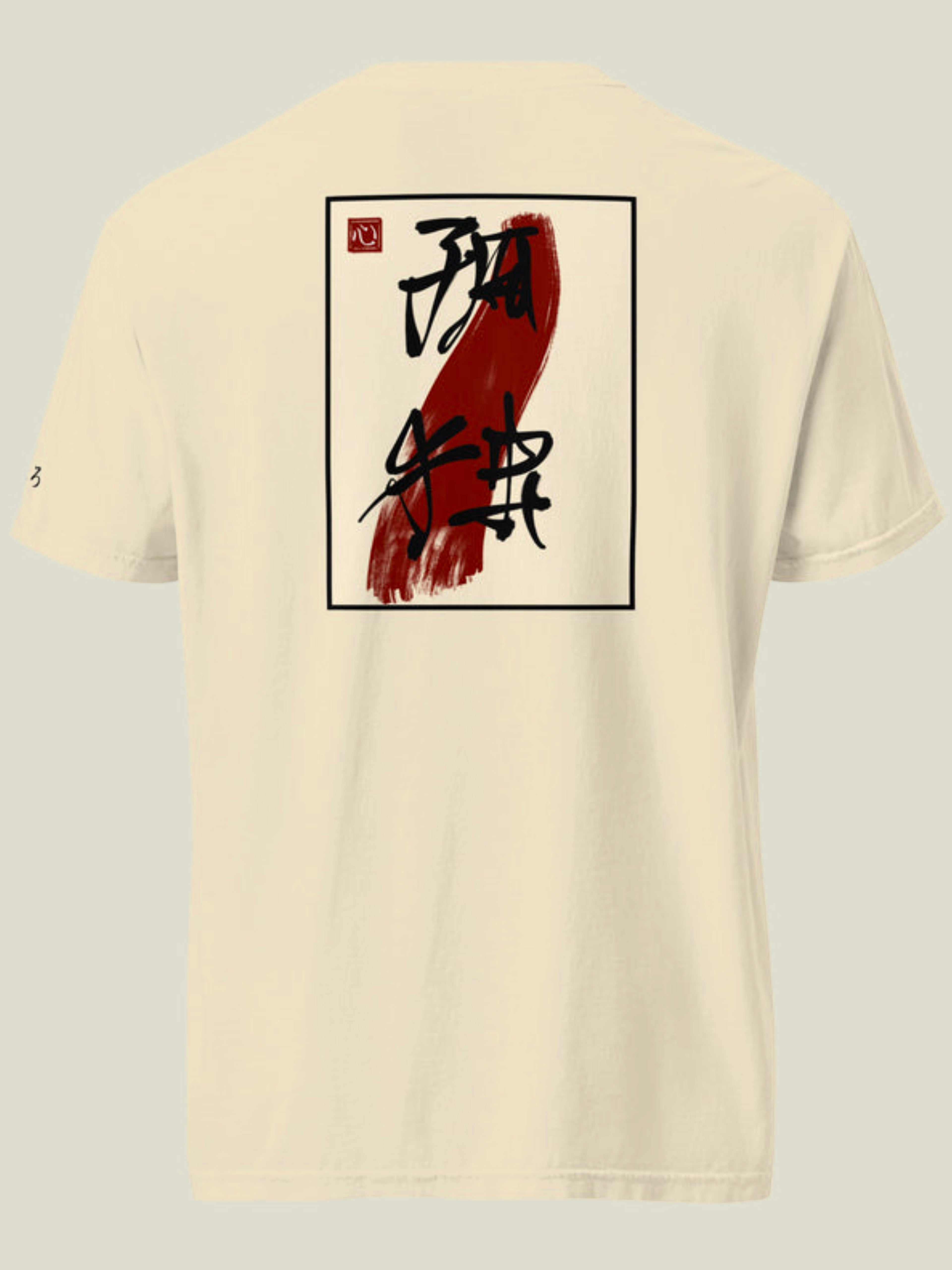Back view of a cream tee shirt with balck Japanese calligraphy of “isolation” over a dark red brush stroke