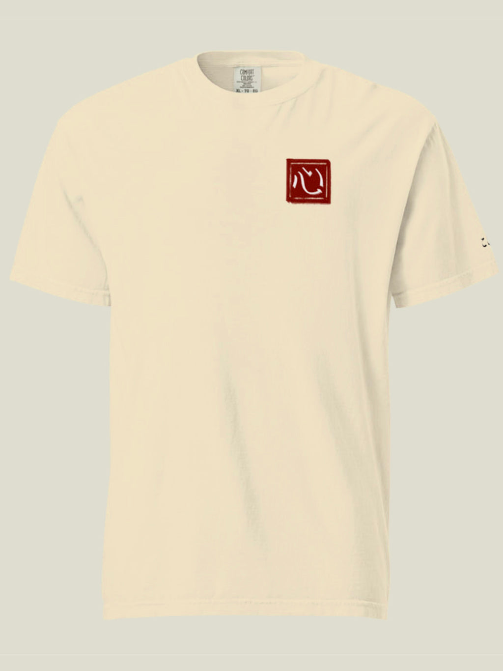 Front view of a cream tee with red Kokoro hanko stamp graphic on the chest