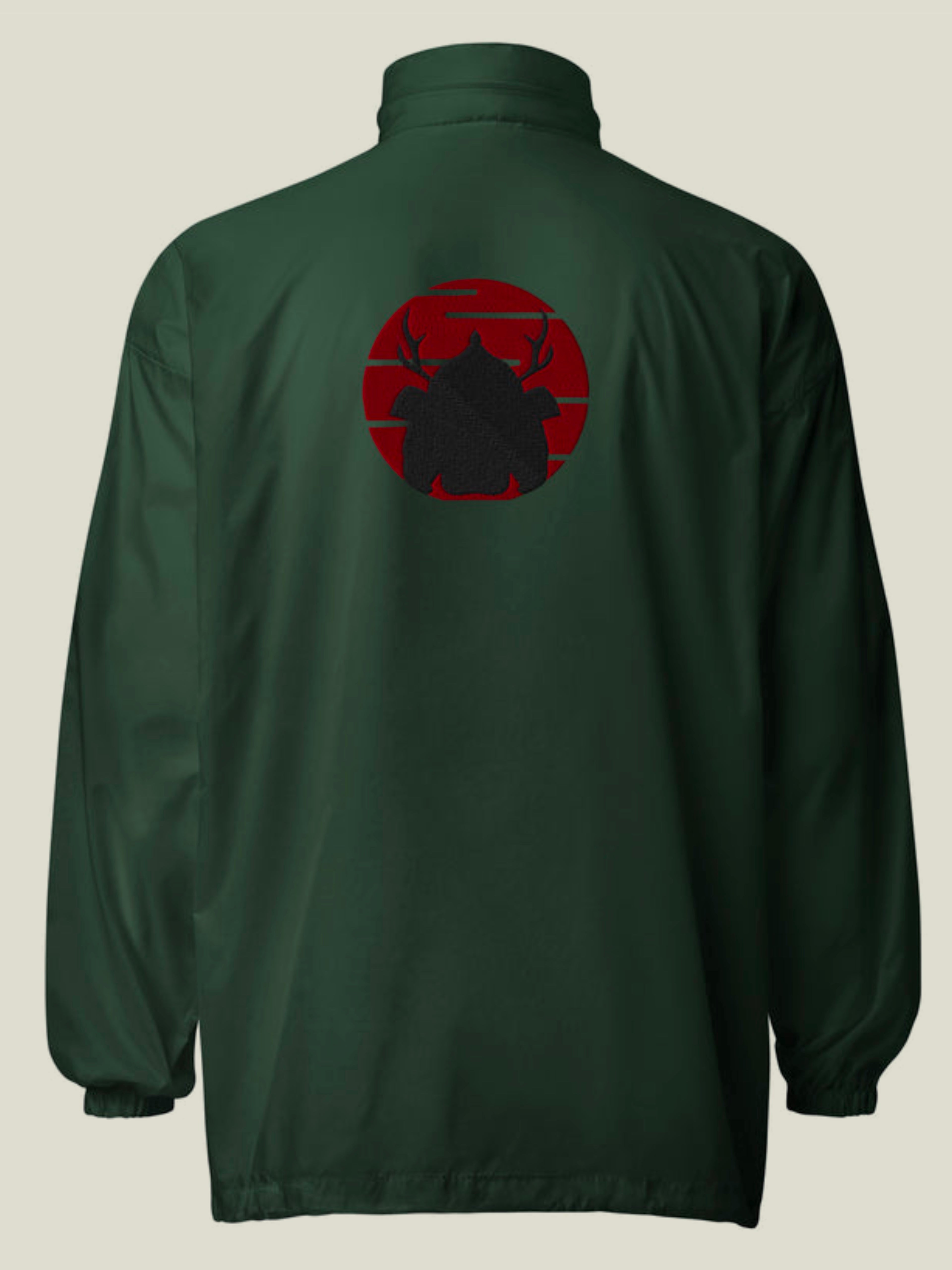 Back of green windbreaker with embroidered red sun and black samurai helmet