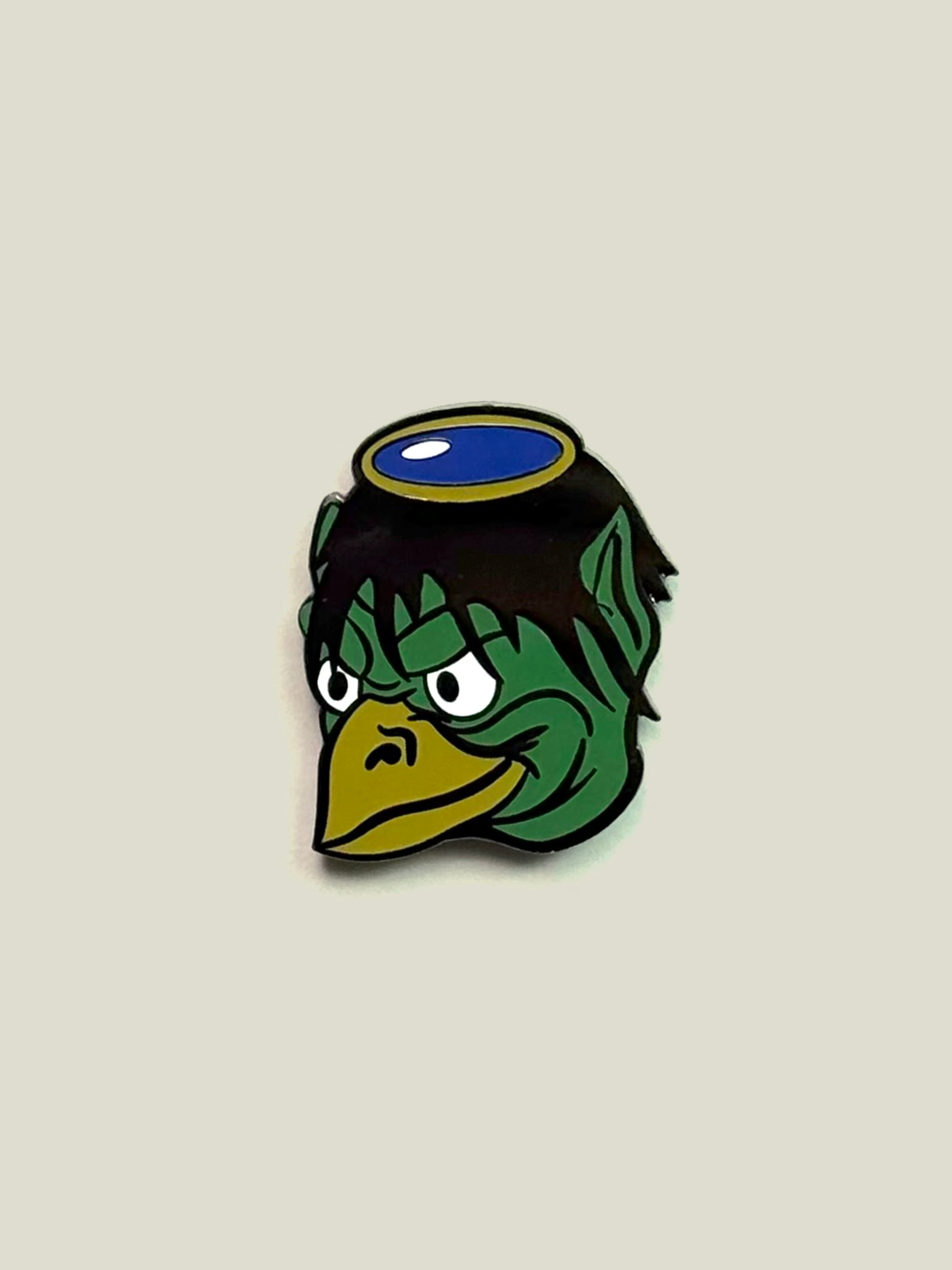 Green Kappa enamel pin with black nickel finish